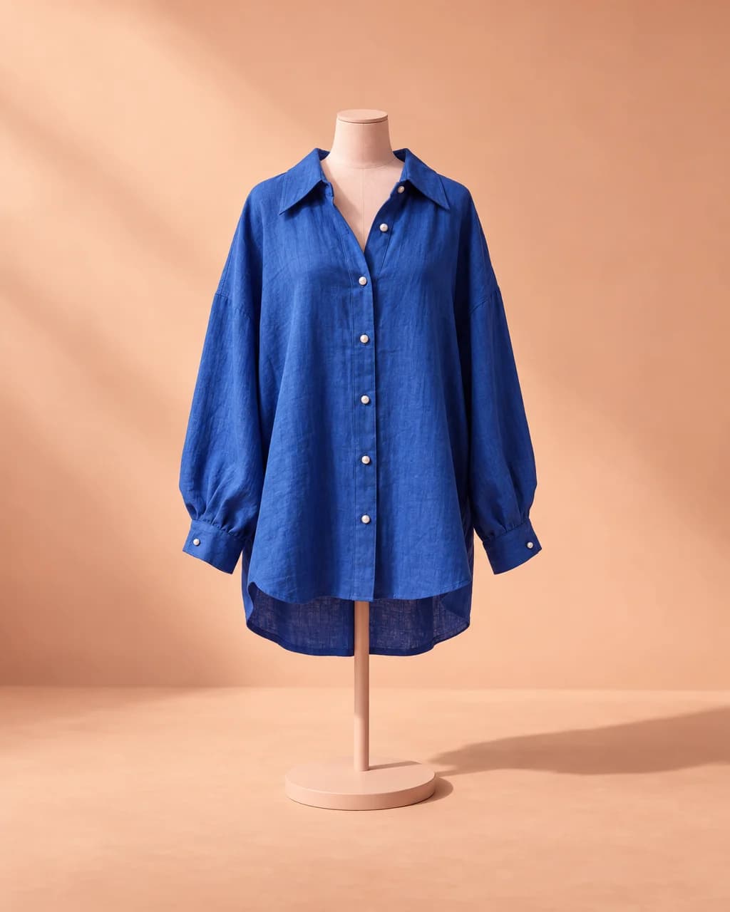 Fictional blue shirt photographed in a studio